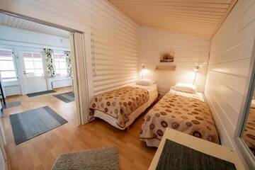 Фото номера Коттедж с 1 спальней и сауной Курортные отели Holiday Resort Harjun Portti г. Пункахарью 9